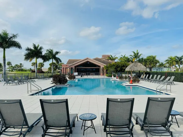 a view of a chairs and table in patio