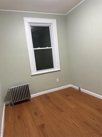 a view of wooden floor with entryway