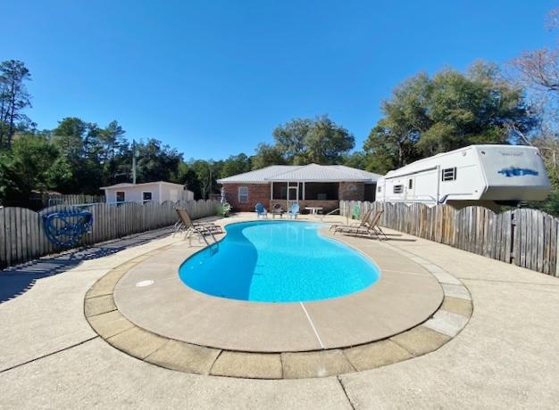814 Site C-6 Road Freeport, FL 32439 - Photo 27 of 48 View to house from Pool