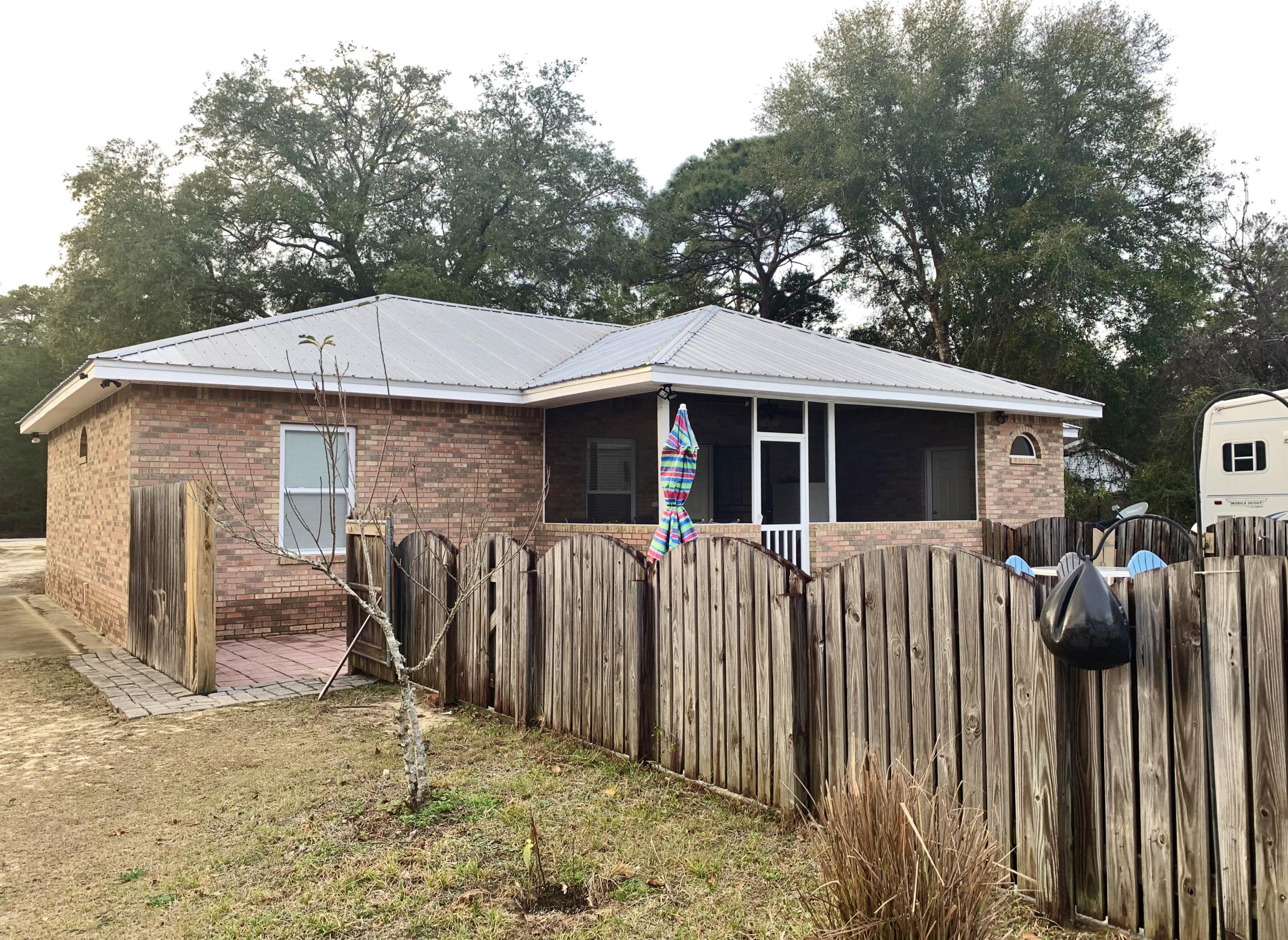 814 Site C-6 Road Freeport, FL 32439 - Photo 44 of 48 Rear of home and screened porch