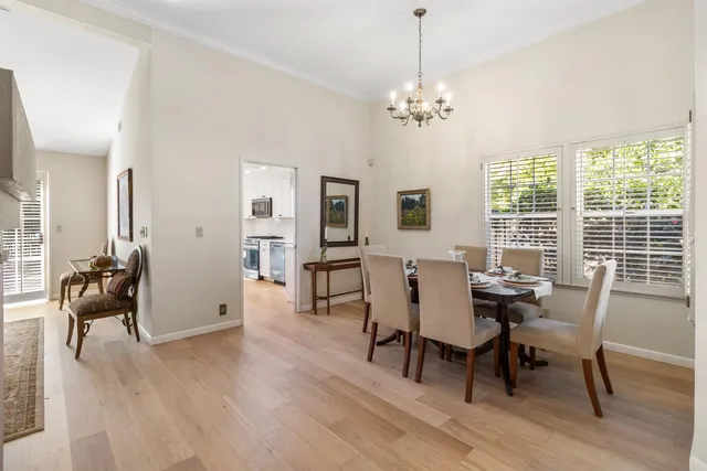 a kitchen with a refrigerator and a sink