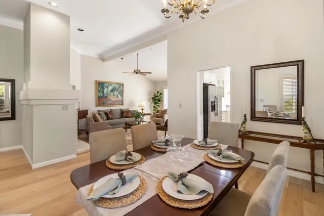 a kitchen with stainless steel appliances granite countertop a refrigerator a stove and a sink