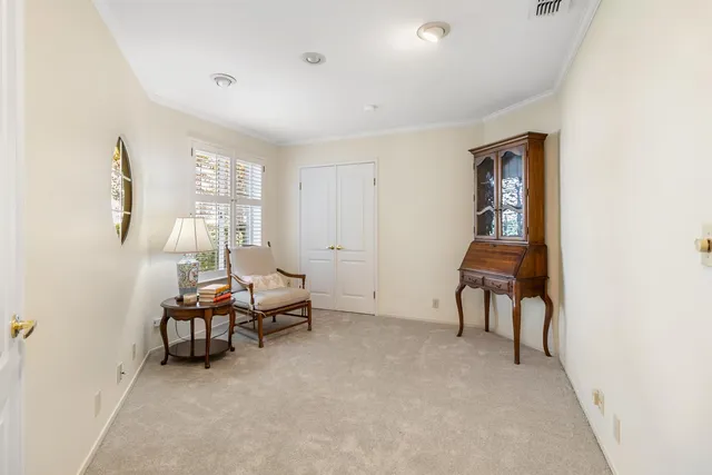 a backyard of a house with lots of green space and plants