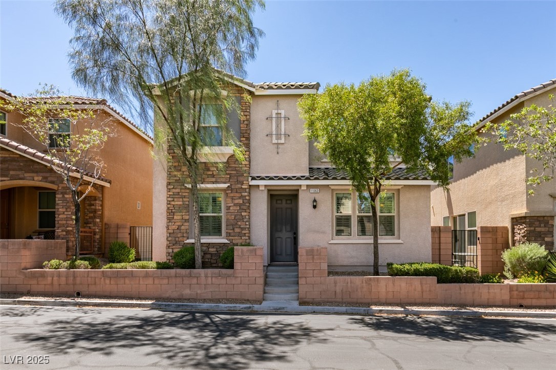 11063 Mt George Street Las Vegas, NV 89179 - Photo 1 of 49 Featuring a tile roof, stucco siding, and stone si