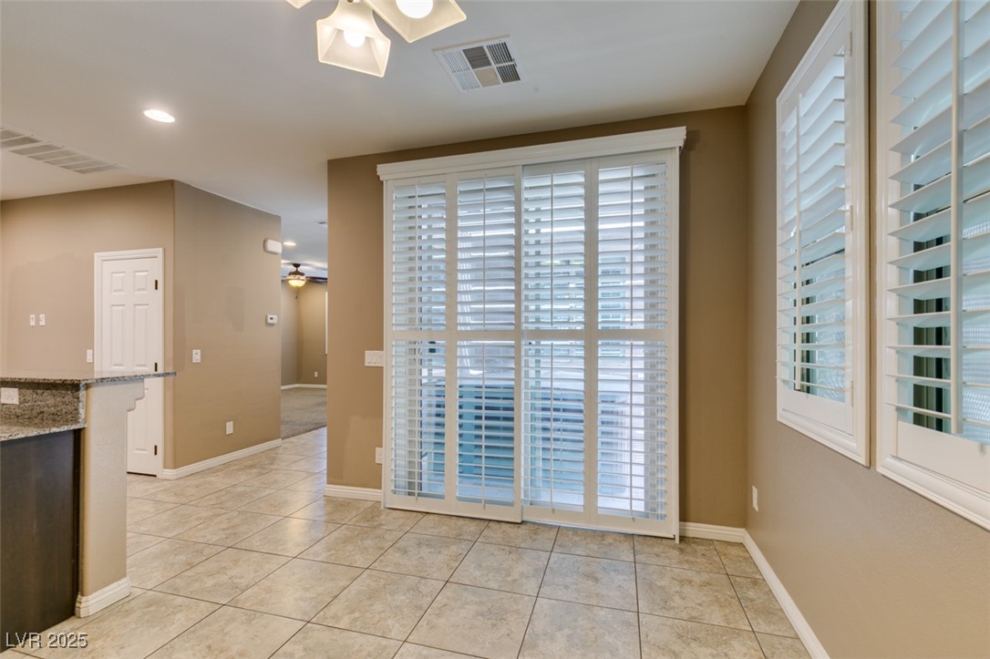 11063 Mt George Street Las Vegas, NV 89179 - Photo 18 of 49 Unfurnished dining area featuring ceiling fan, lig