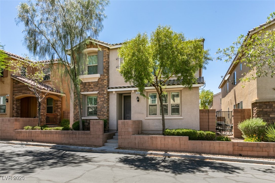 11063 Mt George Street Las Vegas, NV 89179 - Photo 2 of 49 Featuring stucco siding, a tiled roof, stone sidin