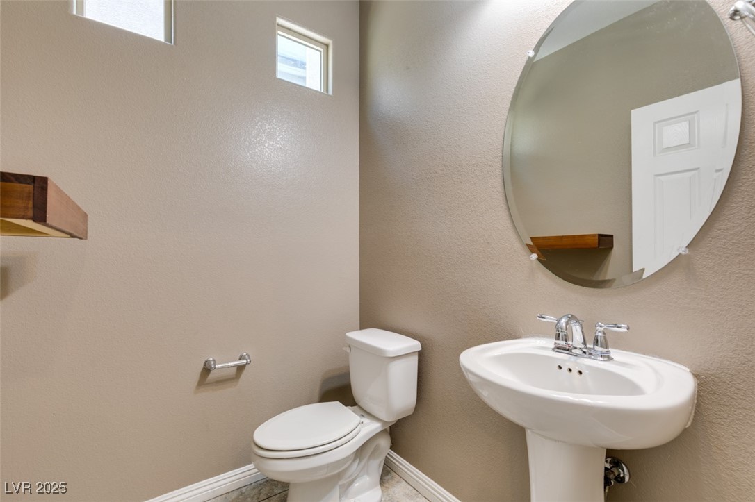 11063 Mt George Street Las Vegas, NV 89179 - Photo 29 of 49 Half bath featuring a textured wall