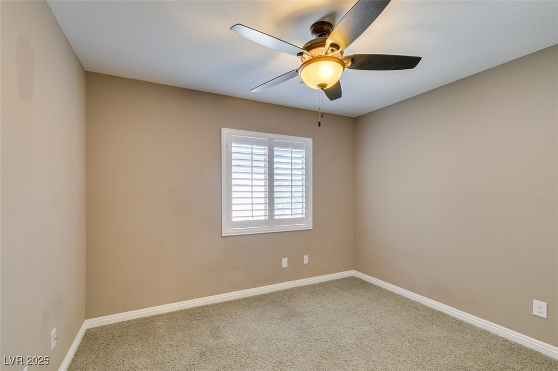 11063 Mt George Street Las Vegas, NV 89179 - Photo 34 of 49 Empty room featuring carpet and ceiling fan