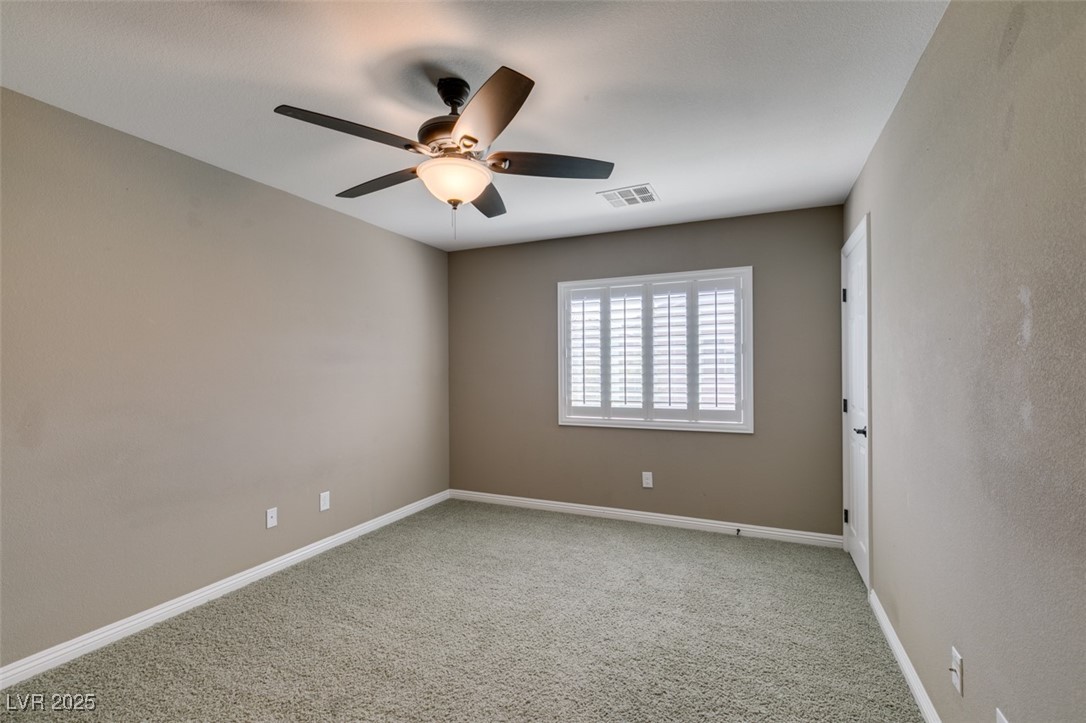 11063 Mt George Street Las Vegas, NV 89179 - Photo 35 of 49 Spare room with a ceiling fan and carpet