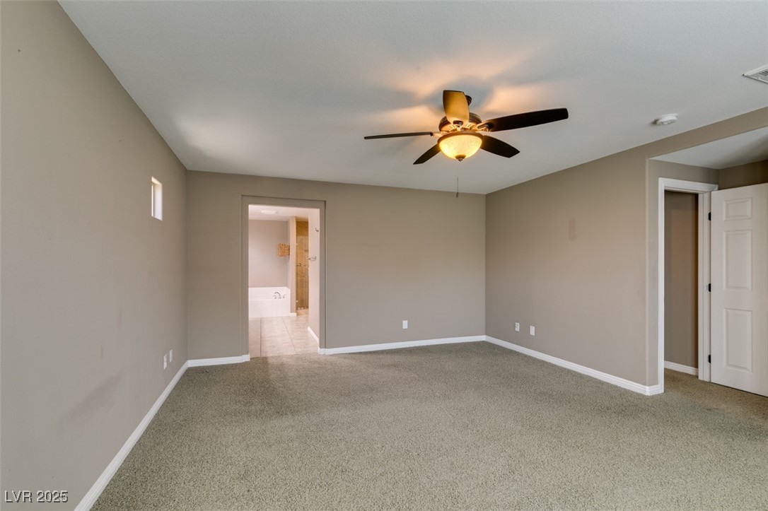 11063 Mt George Street Las Vegas, NV 89179 - Photo 40 of 49 Spare room with a ceiling fan and light carpet