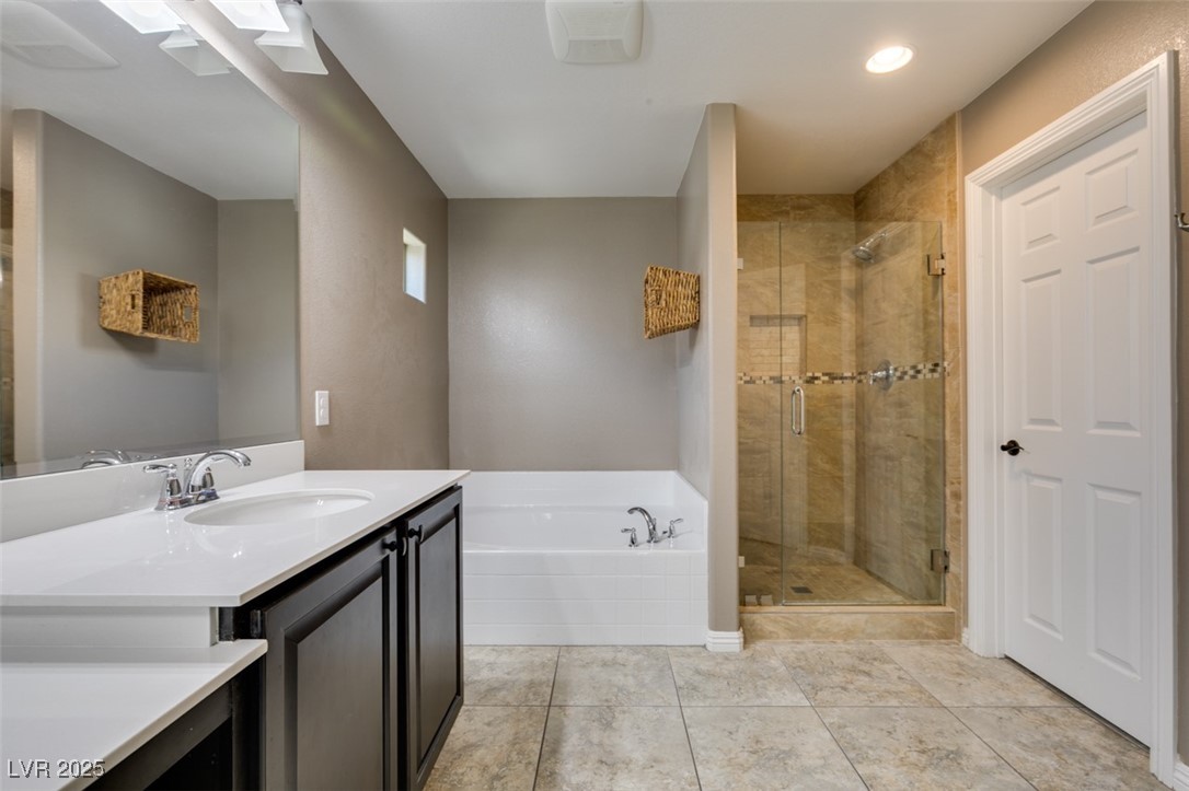 11063 Mt George Street Las Vegas, NV 89179 - Photo 42 of 49 Bathroom with a bath, vanity, a shower stall, tile