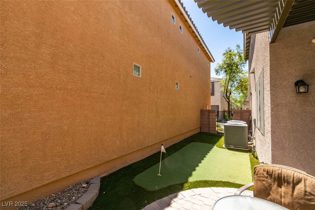 11063 Mt George Street Las Vegas, NV 89179 - Photo 46 of 49 View of side of property with stucco siding and a