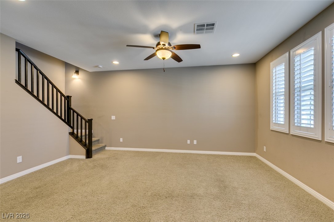 11063 Mt George Street Las Vegas, NV 89179 - Photo 5 of 49 Carpeted spare room with a ceiling fan, stairs, an