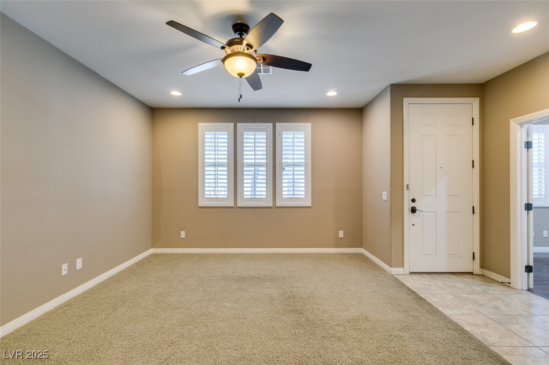 11063 Mt George Street Las Vegas, NV 89179 - Photo 8 of 49 Unfurnished room with ceiling fan, light carpet, r
