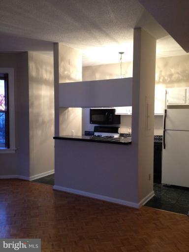 1851 Columbia Road Northwest, Unit 608 Washington, DC 20009 - Photo 11 of 16 a view of an empty room with a window