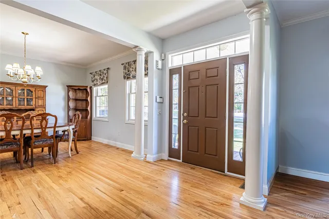 a view of a livingroom with furniture window and wooden floor