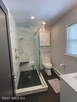 52 Prospect Street, Unit 2 Greenwich, CT 06830 - Photo 3 of 17 a bathroom with a sink a toilet and a shower