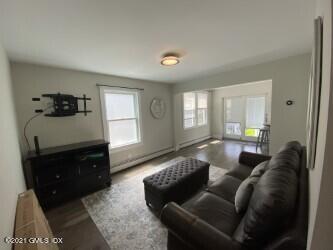 52 Prospect Street, Unit 2 Greenwich, CT 06830 - Photo 7 of 17 a living room with furniture and a window