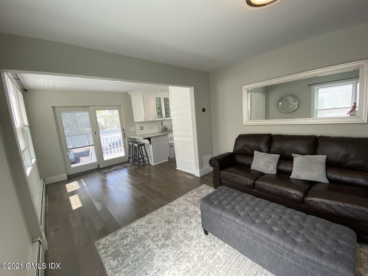 52 Prospect Street, Unit 2 Greenwich, CT 06830 - Photo 8 of 17 a living room with furniture and a wooden floor