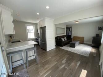 52 Prospect Street, Unit 2 Greenwich, CT 06830 - Photo 9 of 17 a living room with furniture and a flat screen tv