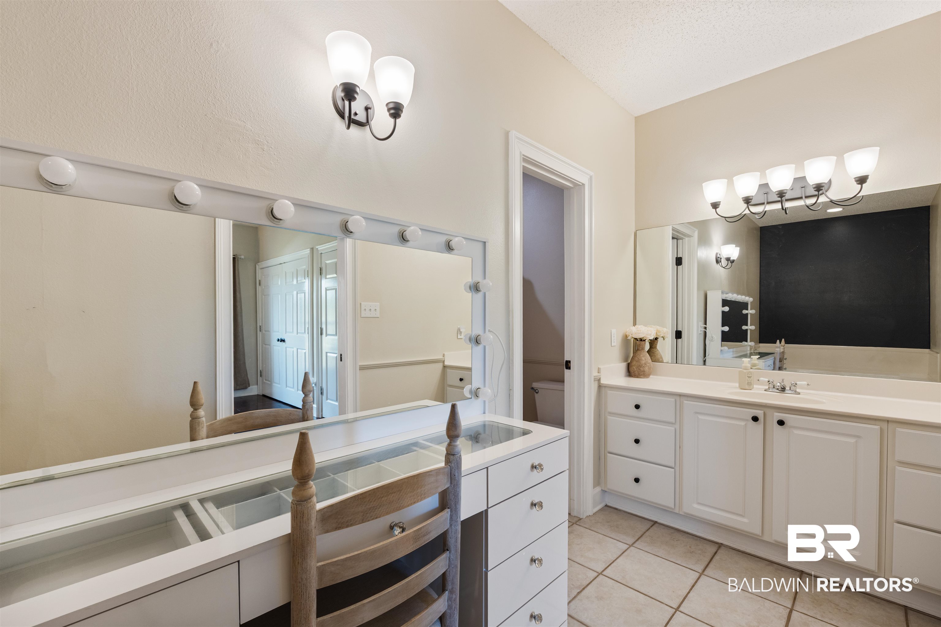 9855 Stucki Road Elberta, AL 36530 - Photo 33 of 54 Bathroom with vanity and light tile patterned floors