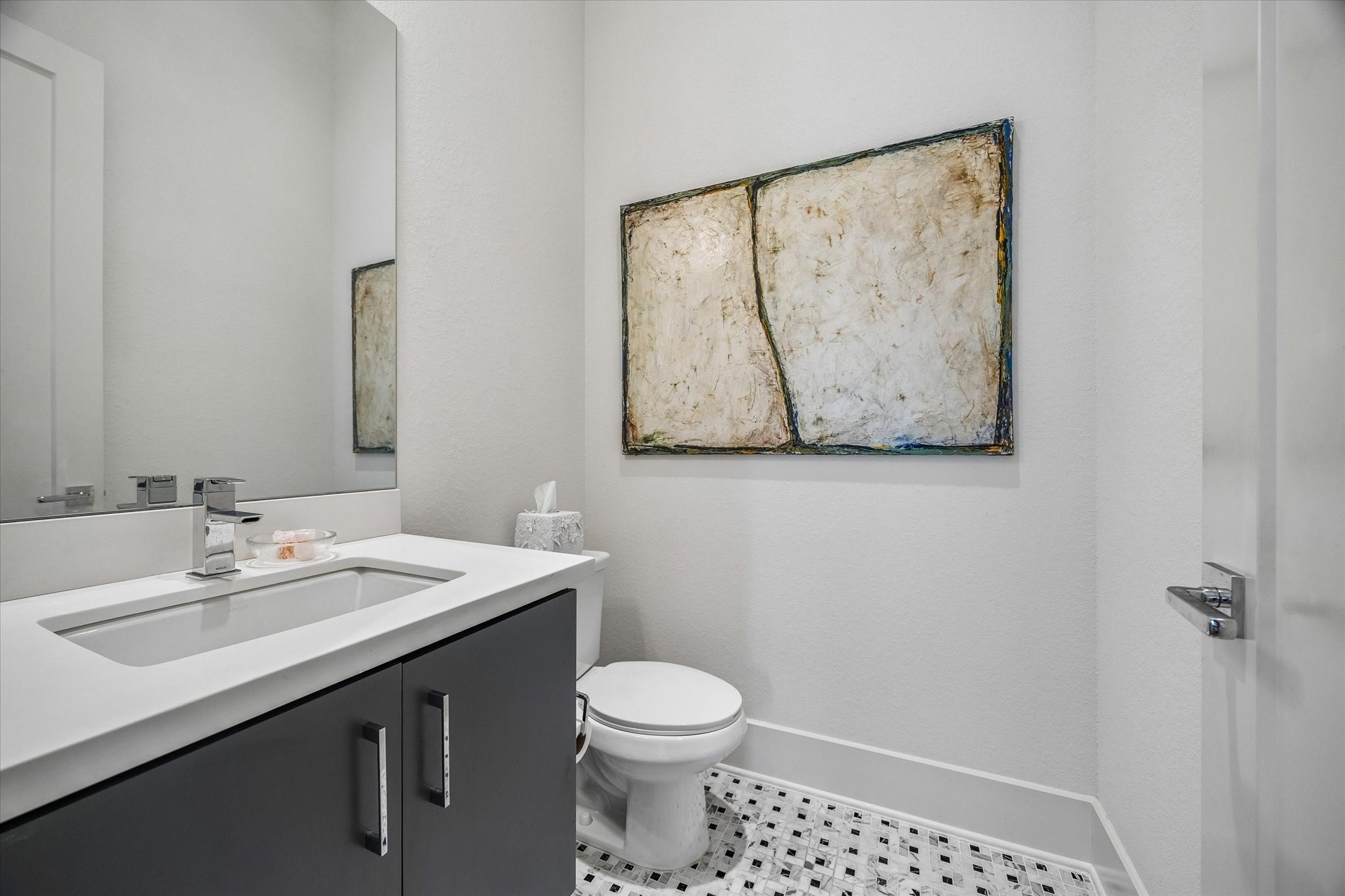 1526 Vermont Street Houston, TX 77006 - Photo 26 of 39 Stylish powder bath with modern vanity, clean lines, and sleek finishes.