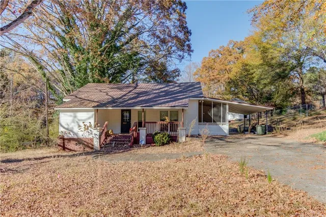 a view of a car park in front of house
