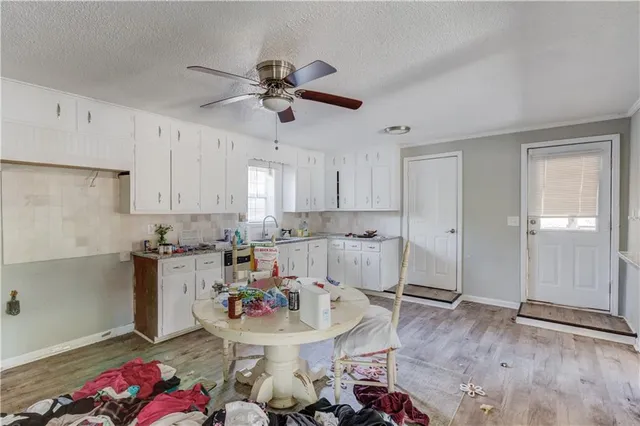 a kitchen with a sink and cabinets