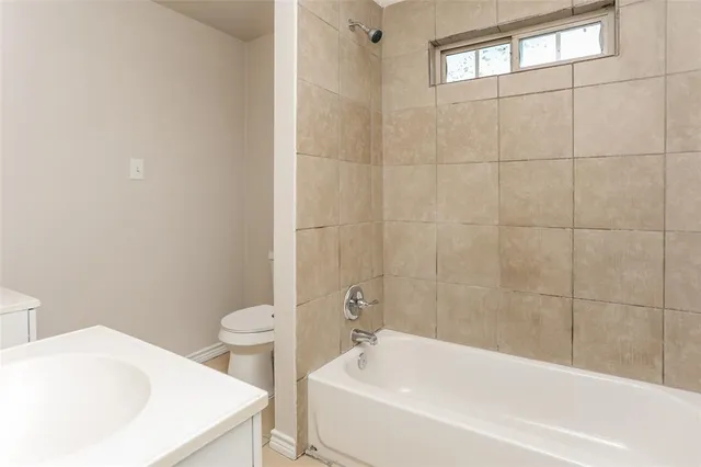 a front door view of a house with a yard