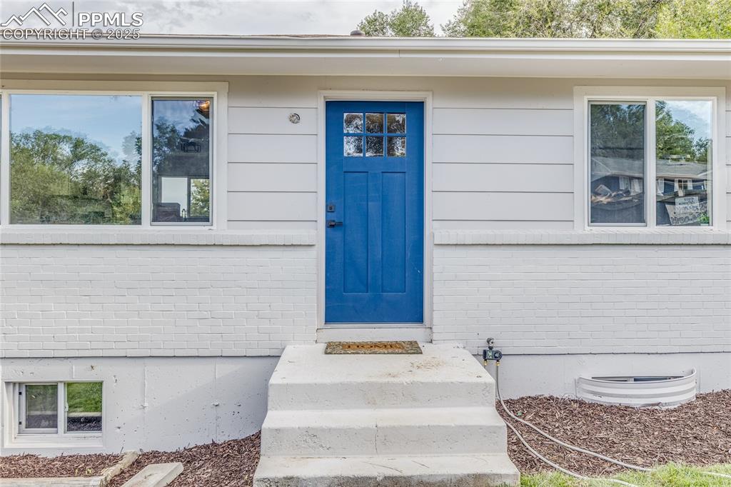 a bathroom with a toilet and a window