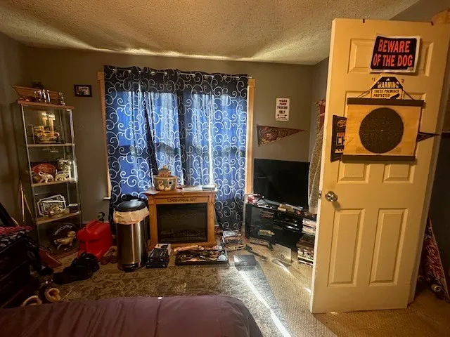 a view of a livingroom with furniture and a flat screen tv