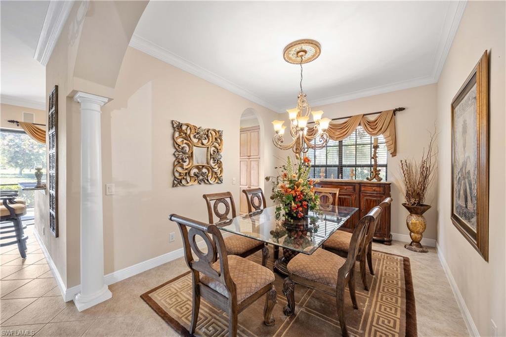 9105 Prima Way, Unit 102 Naples, FL 34113 - Photo 16 of 49 a view of a dining room with furniture window and outside view