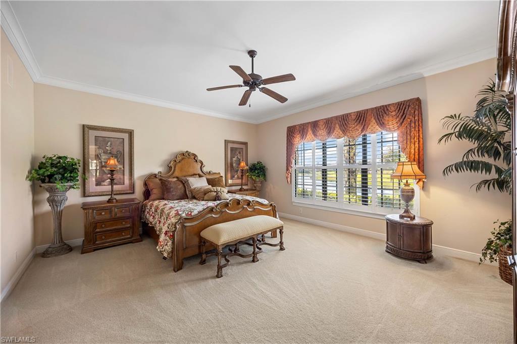 9105 Prima Way, Unit 102 Naples, FL 34113 - Photo 17 of 49 a bed room with furniture and a window