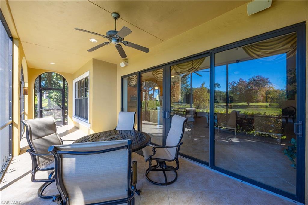 9105 Prima Way, Unit 102 Naples, FL 34113 - Photo 28 of 49 a view of a dining room with furniture window and outside view