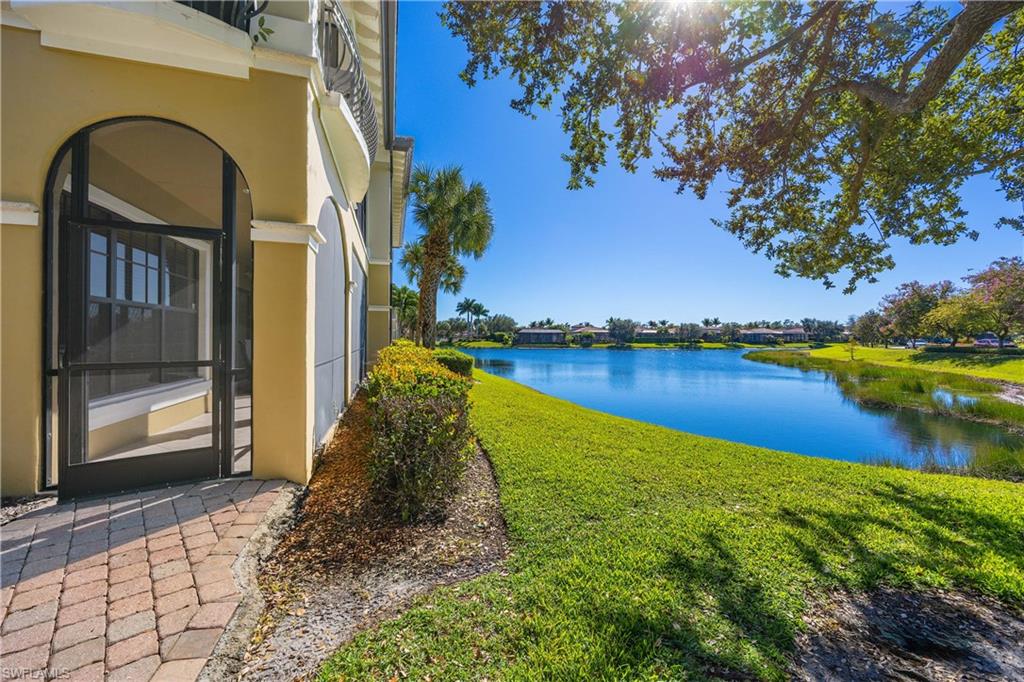 9105 Prima Way, Unit 102 Naples, FL 34113 - Photo 29 of 49 a view of a lake with a house