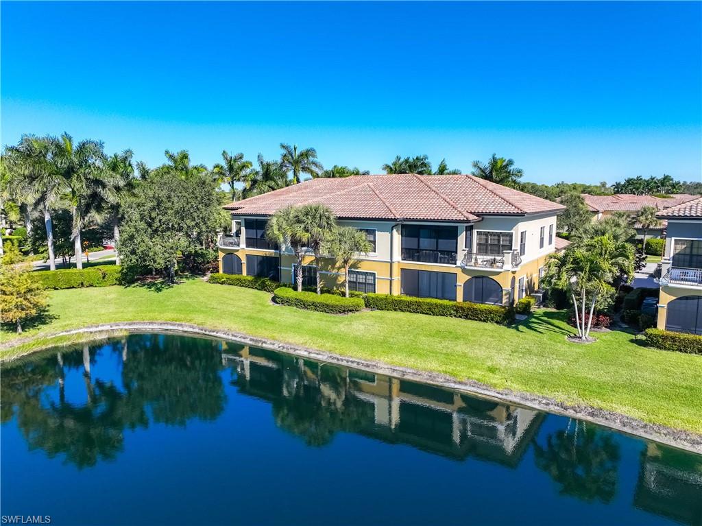 9105 Prima Way, Unit 102 Naples, FL 34113 - Photo 39 of 49 a view of an house with backyard space and balcony