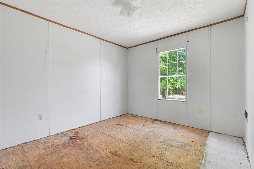 249 John Golden Road Temple, GA 30179 - Photo 34 of 45 an empty room with windows
