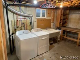 a view of a house with a yard and tree