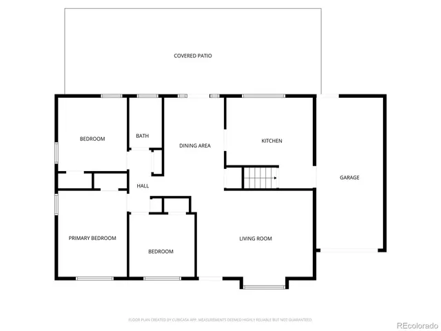 a picture of a bench in front of a wall