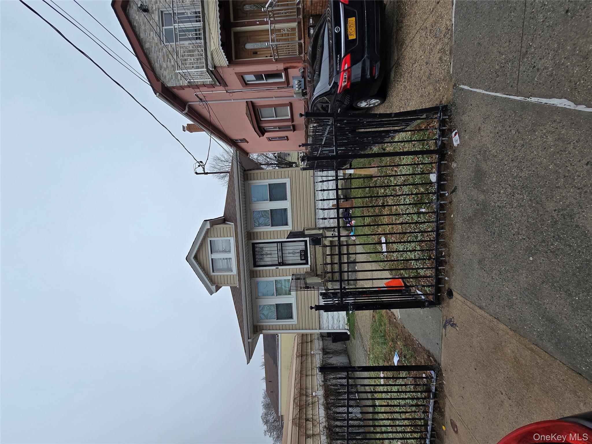 142-62 Bascom Avenue Queens, NY 11436 - Photo 2 of 3 a view of a car park in front of house