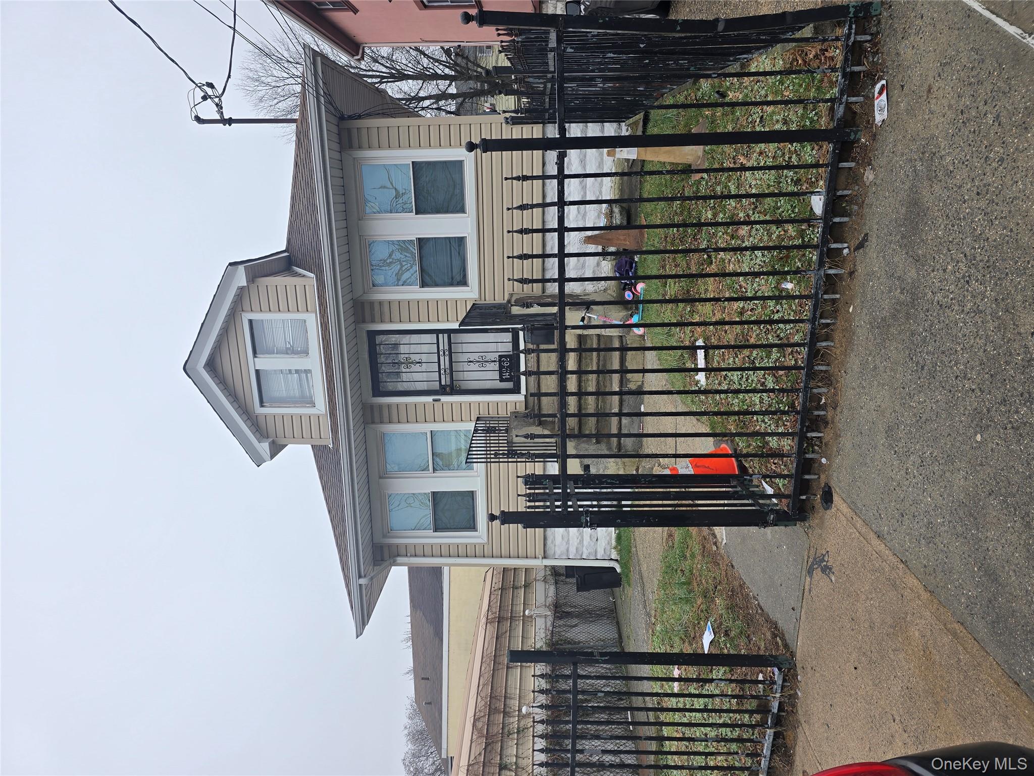 142-62 Bascom Avenue Queens, NY 11436 - Photo 3 of 3 a front view of a house with glass windows