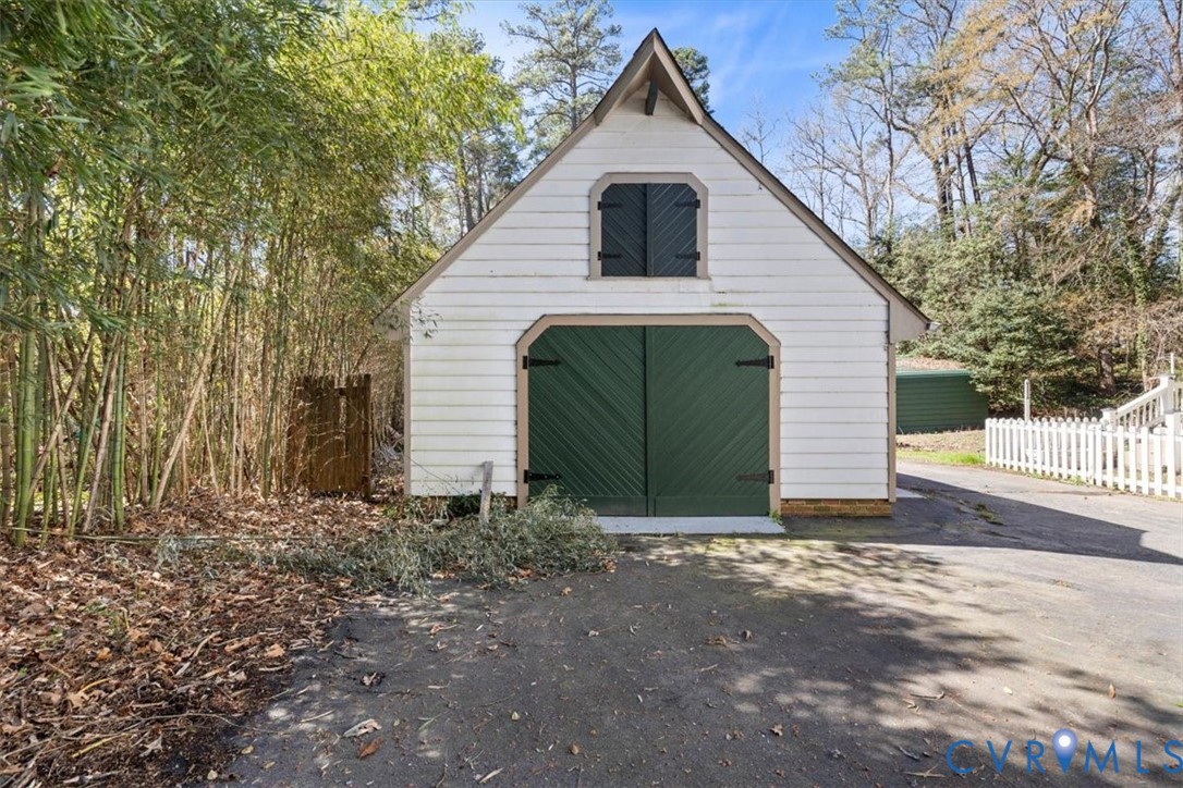 11716 Ivywood Road Chester, VA 23831 - Photo 30 of 38 a view of a house with a yard and garage