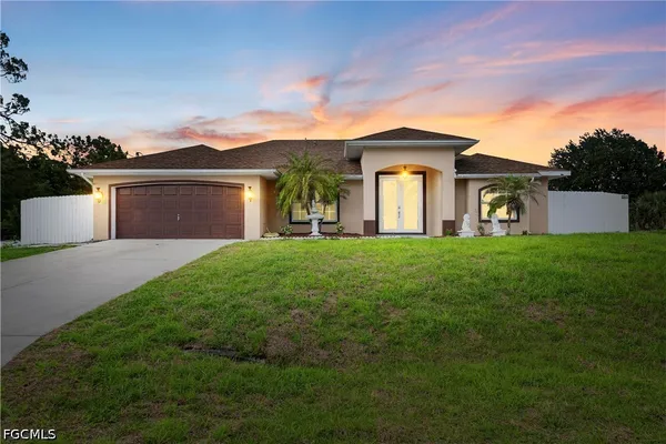 a front view of a house with garden