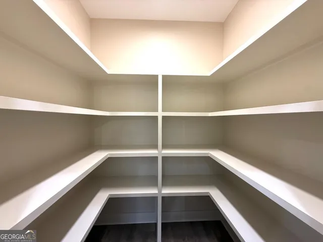 a view of a room with shelves on the wall