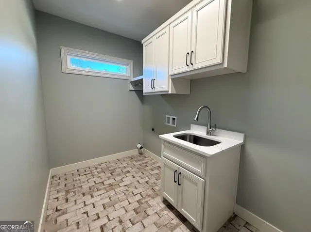a kitchen with white cabinets