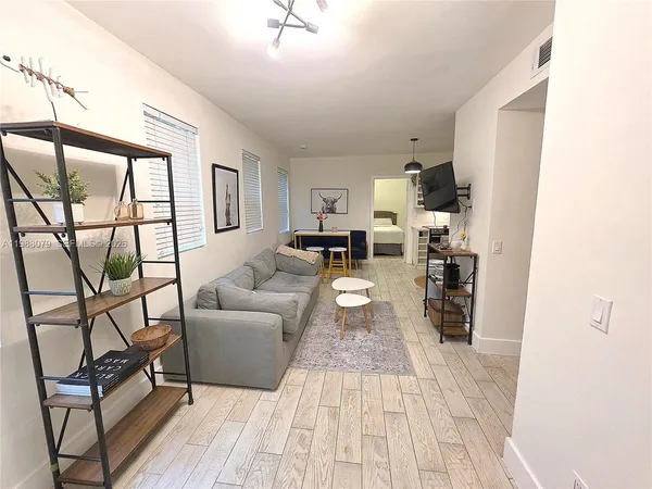 a living room with furniture and a table
