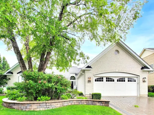 a large kitchen with kitchen island granite countertop a large counter top space a sink stainless steel appliances and cabinets