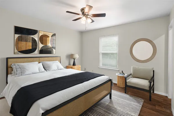 a bedroom with a bed and lamp