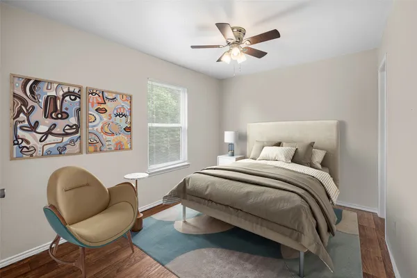 a bedroom with a bed and a chair