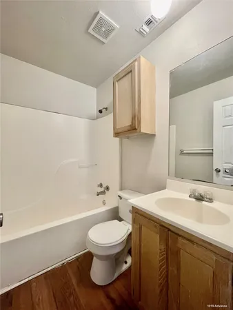 a bathroom with a sink a toilet and a bathtub